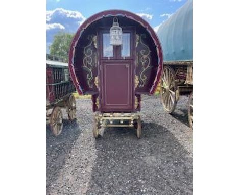 HALF SIZE BOW TOP WAGON painted maroon with cream undercarriage on iron tyred wheels. Inside, the red painted interior, compl