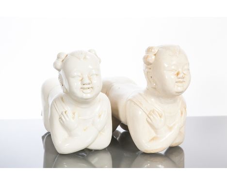 PAIR OF CHINESE BLANC DE CHINE FIGURES
Modelled as figures on their elbows and knees, 26cm long
