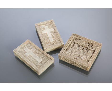 THREE EARLY 20TH CENTURY CHINESE IVORY GAMING BOXES
one with CHINESE figures under a tree, the other two each with a cross an