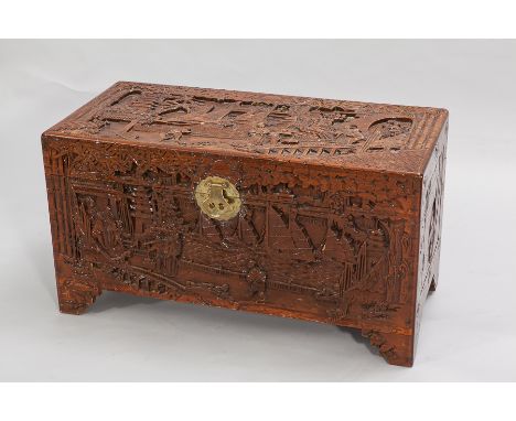 CHINESE CARVED WOOD BLANKET BOX 
carved overall with boats and figures, 93cm wide 
