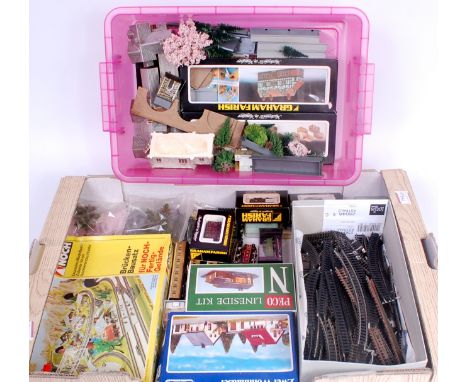 A small scenic N gauge layout 150cm x 80cm sold with quantity of buildings and scenic items to complete and rolling stock, LN