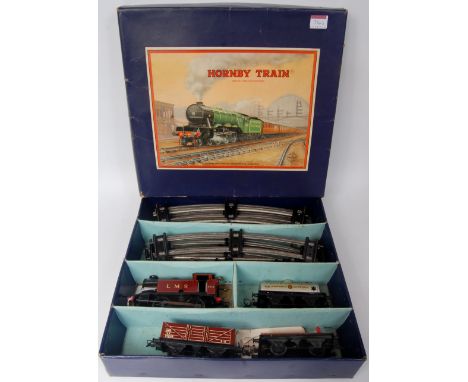 A large tray containing an assortment of post war mainly Hornby, including LMS No.201 Tank goods set comprising C/W 0-4-0 loc