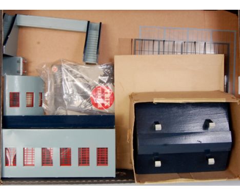 Tray of wooden and metal Manyways station parts, building, clock tower, 2 goods  sheds, 3 engine sheds, footbridge etc, all a