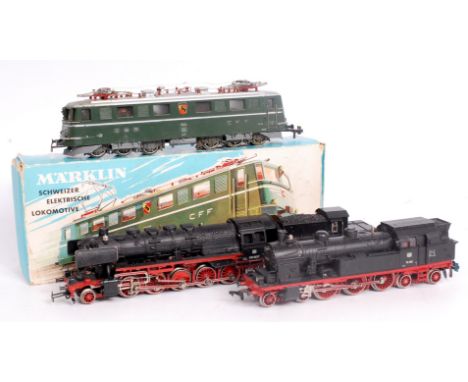A Marklin H0 3050 Swiss Co-Co electric locomotive in blue picture box (G-BF) a 2-10-0 engine and tender (G) and a 4-6-4 tank 