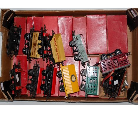 A large tray of 13 Hornby boxed post war wagons including crane truck, SR Milk Traffic, BR Milk traffic, BR Flat with cable d