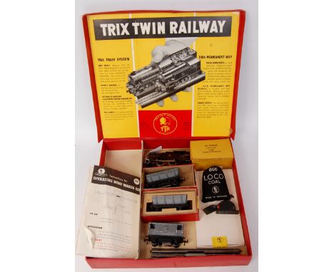 A Trix Twin Railways red set box containing parts for a 1/336 operating mineral train set, contains later plastic tank engine