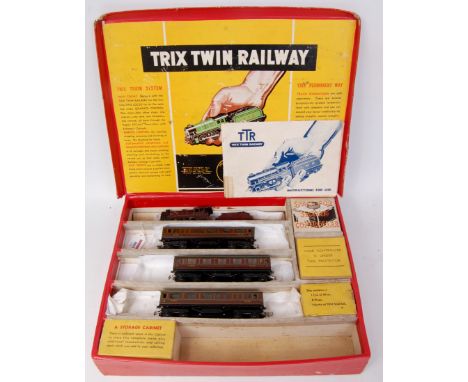 A Trix Twin Railway train set containing LMS maroon 6200 freelance engine and tender, 2 brake 3rd coaches 1st class coach all