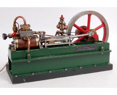 A single cylinder horizontal engine driven by a 240 volt synchronous motor via chain drive cylinder, 1.25 bore, 2 inch stroke