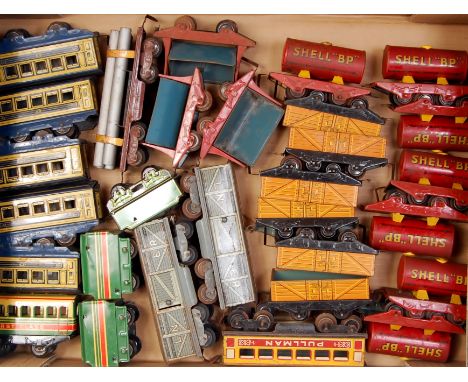 A large tray of assorted Wells/Brimtoy items including 7x Shell/BP tankers, 6x open trucks, 3x tipping trucks, 2x LNER bogie 