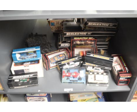 A shelf of 1970's and 1980's Scaletrix Cars and Track, March Ford 721, Airfix MRRC Performance car, C052 Ford Escort Mexico S