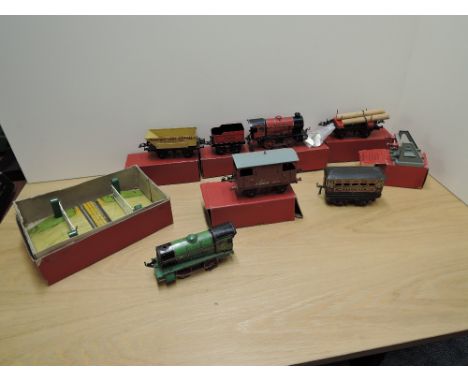 A collection of Hornby 0 gauge including M1 Locomotive and Tender, No 50 Goods Brake Van, No 1 Lumber Wagon, No 1 Rotary Tipp