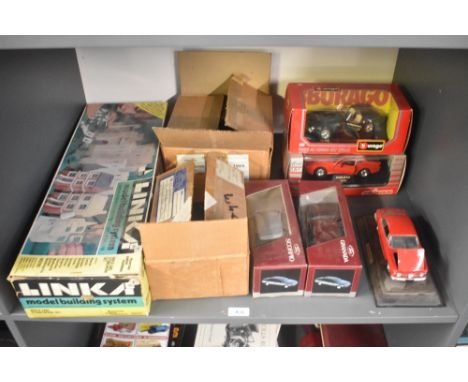 A shelf of mixed toys including Linka Model Building System , Schabak 1:25 scale diecasts, 1500 Ford Scorpio &amp; 1501 Ford 