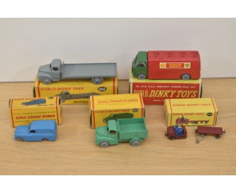 Five Dublo Dinky die-casts, 063 Commer Van, 064 Austin Lorry, 066 Bedford Flat Truck, 070 AEC Mercury Tanker Shell BP and 076