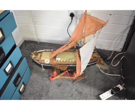 A scratch built wooden model Boat, possibly based on the Thames Barge named Kitty, approx length 75cm, on wooden stand