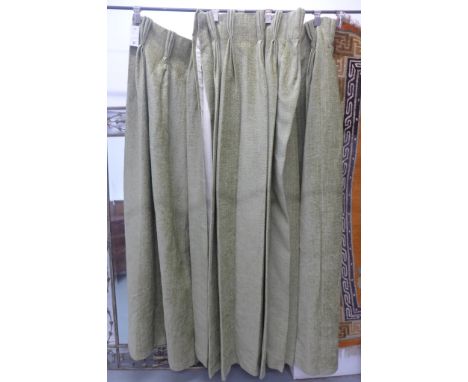 A pair of moss green lined and dry cleaned 46 inch wide x 96inch drop curtains 