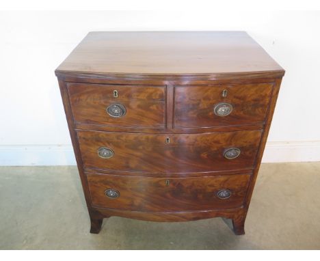 A 19th century mahogany bow fronted four drawer chest of small proportions on splayed bracket feet, 80cm tall x 70cm x 50cm, 