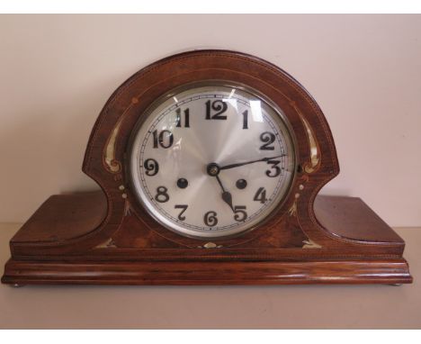 An inlaid mahogany striking mantle clock, 43cm wide, running 