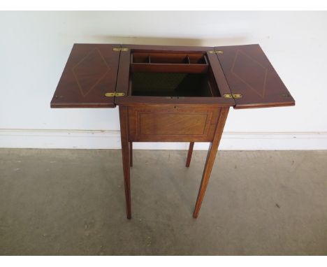 A Edwardian mahogany lamp/sewing table with fruitwood cross banding and ebony line inlays together with fitted interior, full