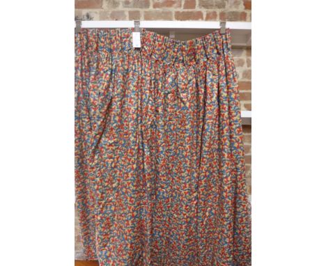 A pair of navy and red paisley on tan background lined, 48 inch wide x 995 inch drop curtains, faded to edge 