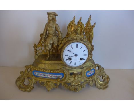 An ormulu and porcelain french figural mantle clock, Henry Mare Paris with silk suspension, 27cm tall, 