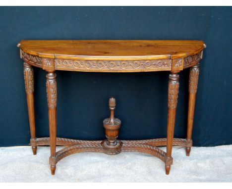 George III style carved mahogany bowfront console table, 77cm high and 110cm long.