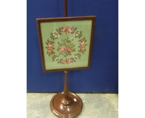 Turned mahogany pole screen with rectangular tapestry panel.