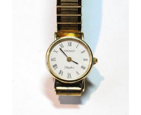 Lady's 9ct gold Tissot Saphir quartz watch on rolled gold bracelet.
