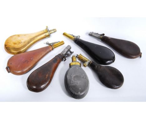 Sykes Patent brass powder flask, 21cm long, an oval embossed pewter flask, 15.5cm long, and five leather powder flasks.  (7)