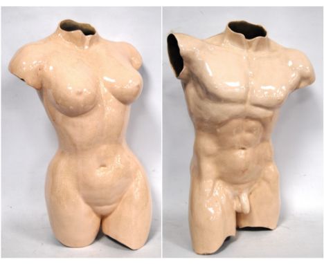 BRITISH (20TH CENTURY)Male and female torsos, glazed ceramic, unsigned, 60cm long and 51cm long.   Condition Report  Visible 