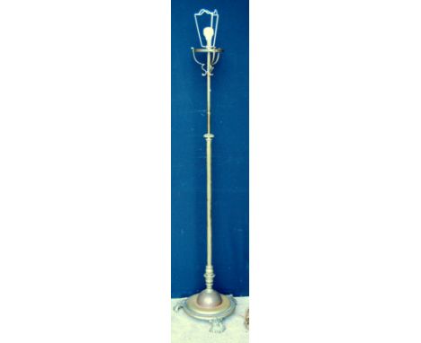 Victorian tubular brass telescopic standard lamp with base, on cast feet.