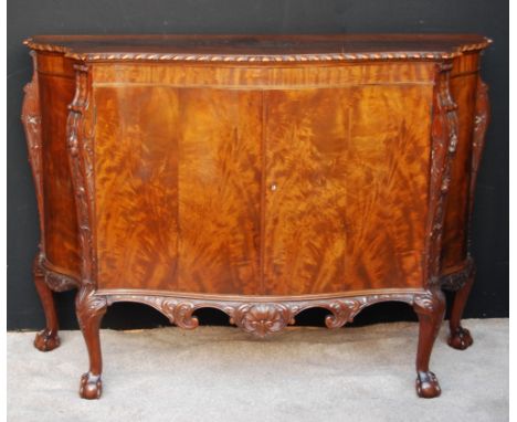 Serpentine mahogany sideboard in the George III style, on carved cabriole legs, 99cm high and 137cm wide. Condition Report Th