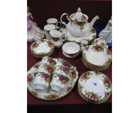 A Royal Albert Old Country Rose Teapot, first quality, and second quality dinner ware of thirty seven pieces.