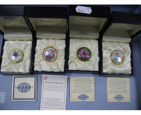 Four Moorcroft Enamel Circular Trinket Boxes, painted with 'Dainthus', 'Hibiscus', 'Pink Daisies' and 'Lewisia', each 3cm dia