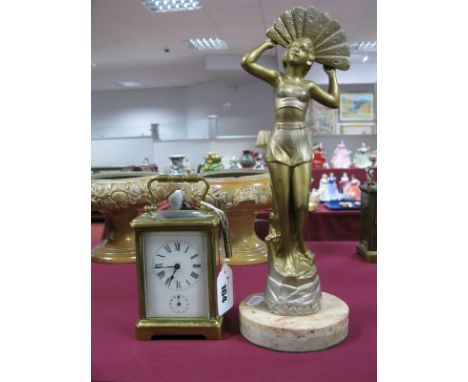 An Early XX Century French Brass Carriage Clock, white enamel dial, Roman numerals, over subsidiary dial, swing handle; and a