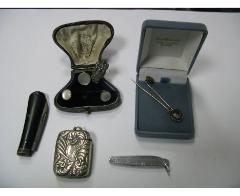 A Vesta Case, of textured foliate design, two decorative stick pins, two pocket knives, gent's shirt buttons, in fitted case,