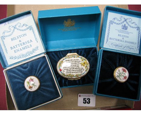 A Bilston &amp; Battersea Oval Enamel Trinket Box, 'Monday's Child.....', 5.3cm diameter and two small circular trinket boxes