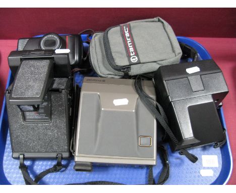 Three Polaroid Cameras, including SX7C- Land camera polasonic autofocus model 2, plus a Nikon TW 200m 35mm film compact camer