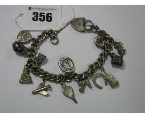 A Hallmarked Silver Curb Link Bracelet, to heart shape padlock clasp, suspending numerous charm pendant including a violin, h