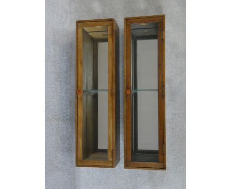 A pair of vintage oak mirror backed wall cabinets. H.94xW.26xL.22cm 