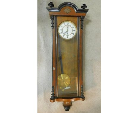 A 19th century walnut and ebonised cased Vienna regulator wall clock the enamel dial with Roman numerals and subsidiary secon