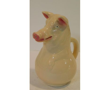 A Sarreguemines majolica ceramic jug in the form of a pig, impressed pat.no 3318 and makers mark. Pale blue interior. H.24cm 