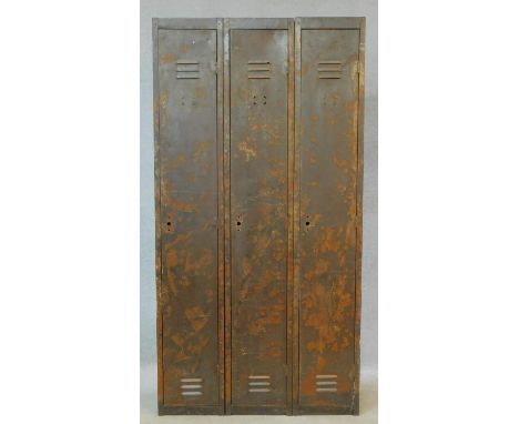 A vintage metal floor standing three section industrial locker. H.180 W.93 D.38cm 