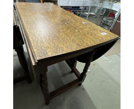 A mid 20th century oak gate leg table