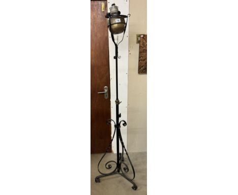 A Victorian wrought iron standard lamp