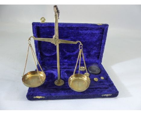 Brass cased weighing scales with weights