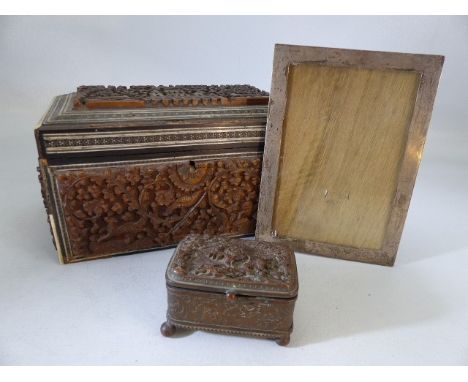 Carved tea caddy (A/F) and a small carved trinket box along with a silver picture frame