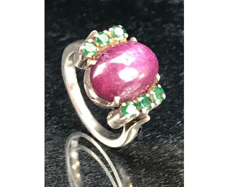 Large Cabochon Oval star Ruby ring with tourmaline stones to the shoulders