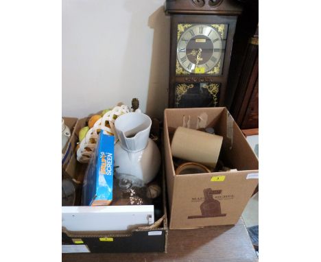 A box of sundries, a wall clock and a box of stoneware