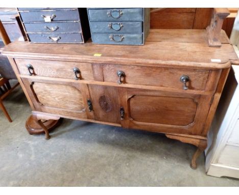 An early 20th century painted oak dressing chest together with a beechwood lamp standard and a 1920's oak mirrorback sideboar