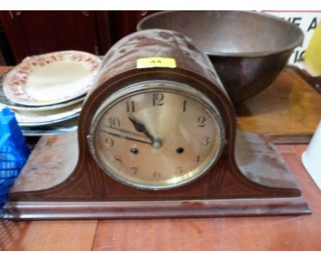 An early 20th century mahogany and line inlaid mantle clock, the two train movement striking on a coiled gong. 19'' wide